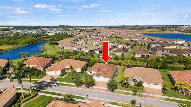 12133 SW Aventino Dr, Port Saint Lucie, FL 34987 - aerial view of residential area with a nearby body of water