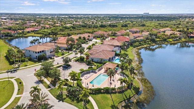 12133 SW Aventino Dr, Port Saint Lucie, FL 34987 - aerial overview of property's location featuring a pool area, a nearby body of water, and nearby suburban area
