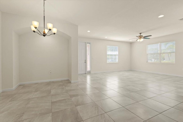 12133 SW Aventino Dr, Port Saint Lucie, FL 34987 - spare room with a chandelier, a ceiling fan, baseboards, recessed lighting, and light tile patterned floors