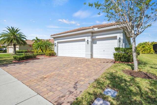 12133 SW Aventino Dr, Port Saint Lucie, FL 34987 - garage featuring decorative driveway