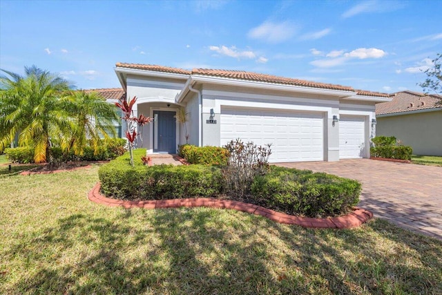 12133 SW Aventino Dr, Port Saint Lucie, FL 34987 - mediterranean / spanish-style home with a tiled roof, an attached garage, driveway, stucco siding, and a front yard
