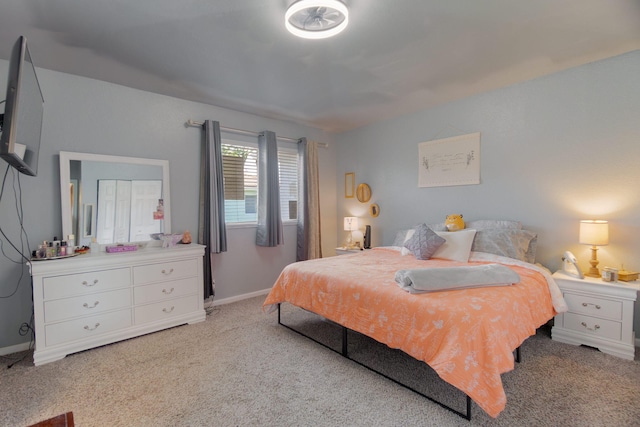 carpeted bedroom with baseboards