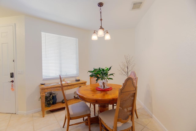 dining room with visible vents, baseboards, light tile patterned floors, and a notable chandelier