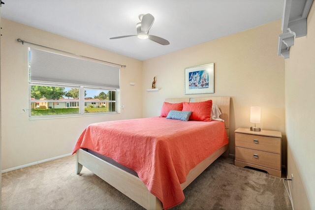 bedroom with baseboards, ceiling fan, and carpet flooring
