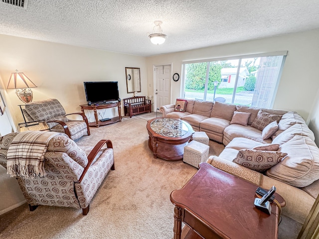 carpeted living room with a textured ceiling and visible vents