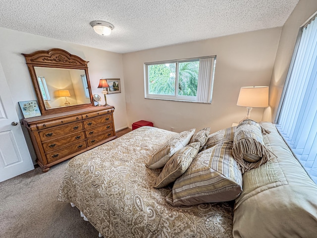carpeted bedroom with a textured ceiling