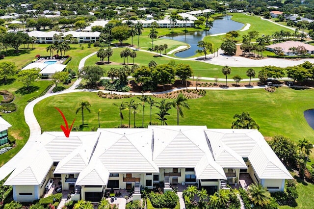 aerial view with a water view and golf course view