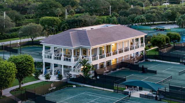 birds eye view of property with a view of trees