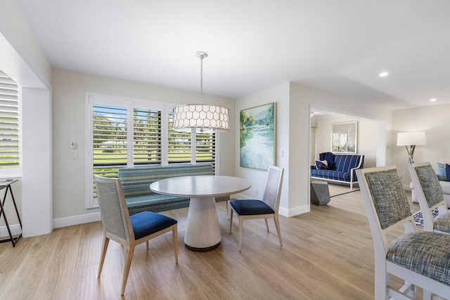 dining space featuring baseboards, recessed lighting, and light wood-style flooring