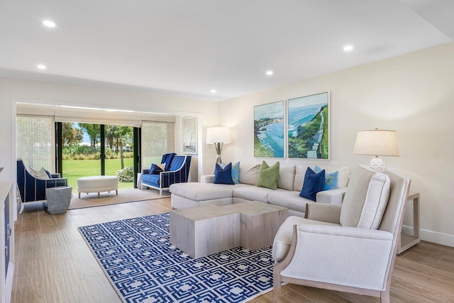 living area featuring recessed lighting and light wood finished floors