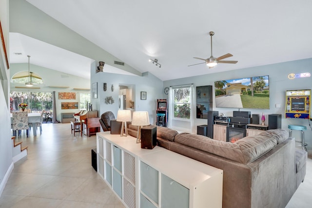 9681 Pine Trail Ct, Lake Worth, FL 33467 - living room featuring lofted ceiling, ceiling fan, and light tile patterned floors