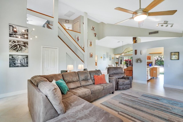 9681 Pine Trail Ct, Lake Worth, FL 33467 - living area with ceiling fan, stairs, high vaulted ceiling, and light tile patterned floors