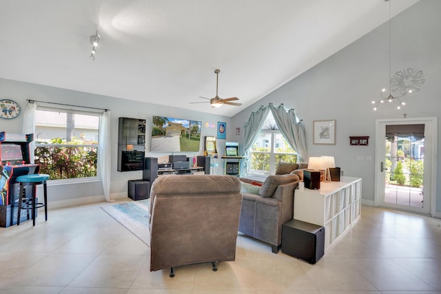 9681 Pine Trail Ct, Lake Worth, FL 33467 - living room featuring ceiling fan, light tile patterned flooring, high vaulted ceiling, and track lighting