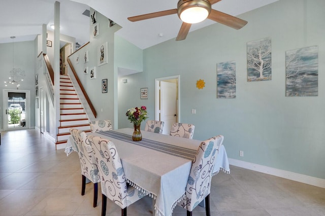9681 Pine Trail Ct, Lake Worth, FL 33467 - dining room featuring high vaulted ceiling, a ceiling fan, stairway, and light tile patterned floors