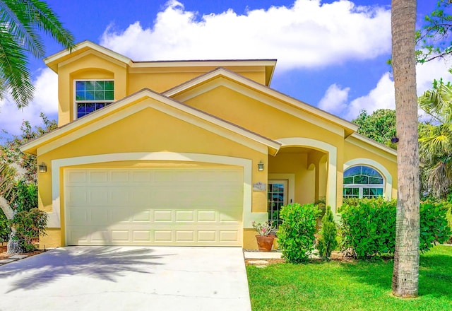 9681 Pine Trail Ct, Lake Worth, FL 33467 - view of front of home featuring stucco siding, driveway, a garage, and a front lawn