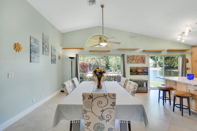 9681 Pine Trail Ct, Lake Worth, FL 33467 - dining area featuring vaulted ceiling, plenty of natural light, light tile patterned floors, and a ceiling fan