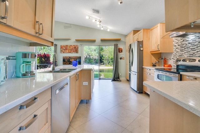 9681 Pine Trail Ct, Lake Worth, FL 33467 - kitchen with appliances with stainless steel finishes, light brown cabinets, vaulted ceiling, tasteful backsplash, and light stone countertops