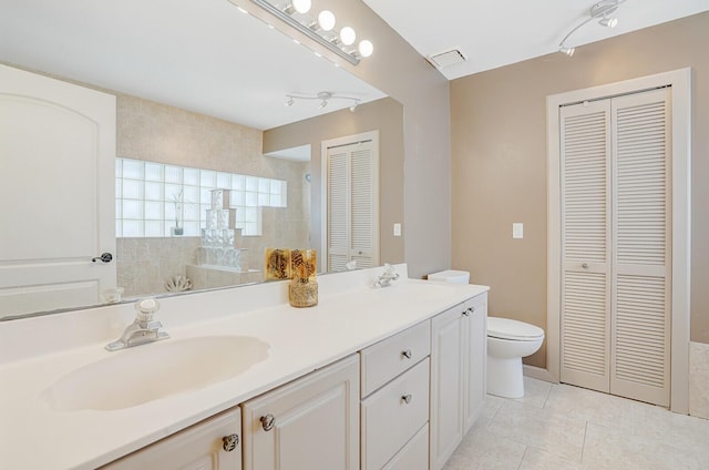 9681 Pine Trail Ct, Lake Worth, FL 33467 - bathroom with a closet, double vanity, rail lighting, tile patterned floors, and walk in shower