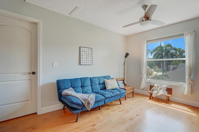 9681 Pine Trail Ct, Lake Worth, FL 33467 - sitting room featuring light wood-style flooring, ceiling fan, and attic access