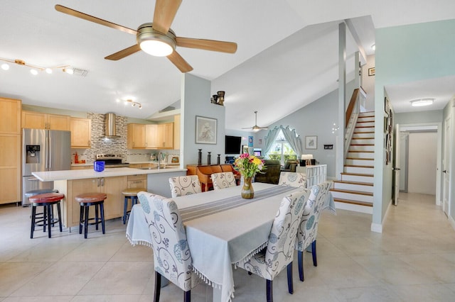 9681 Pine Trail Ct, Lake Worth, FL 33467 - dining area with vaulted ceiling, ceiling fan, stairs, and light tile patterned floors