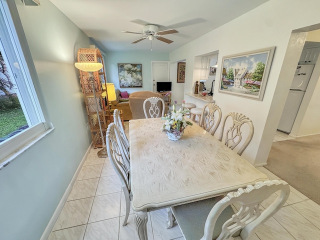dining room featuring baseboards and ceiling fan