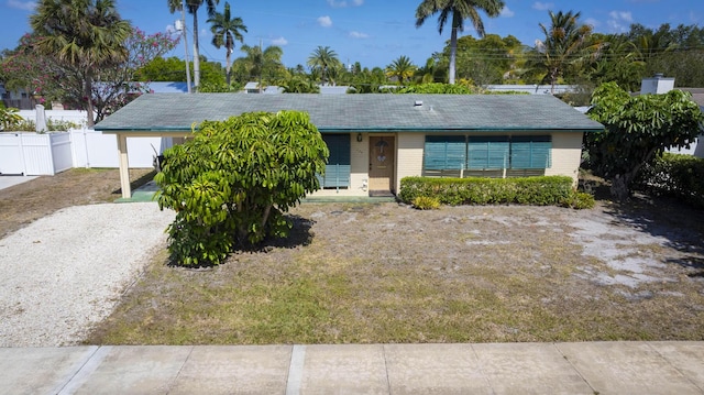 single story home with fence