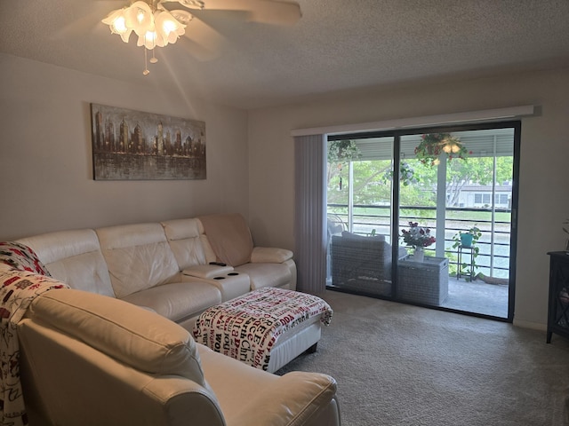 carpeted living room featuring a healthy amount of sunlight, ceiling fan, and a textured ceiling
