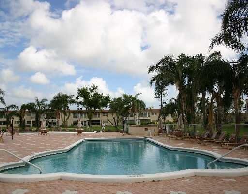 19 Abbey Ln Unit 203, Delray Beach, FL 33446 - pool featuring a patio