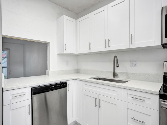 19 Abbey Ln Unit 203, Delray Beach, FL 33446 - kitchen with a sink, white cabinetry, appliances with stainless steel finishes, and light countertops