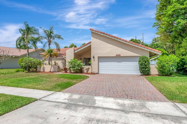 21065 Escondido Way, Boca Raton, FL 33433 - view of front of house with a tile roof, an attached garage, driveway, stucco siding, and a front yard