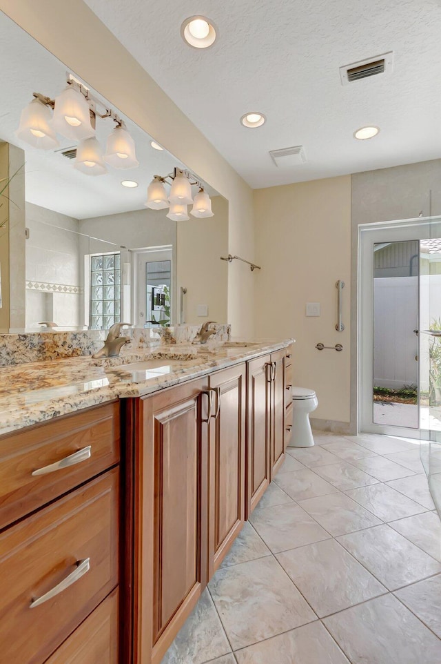 21065 Escondido Way, Boca Raton, FL 33433 - bathroom with toilet, double vanity, recessed lighting, and a shower