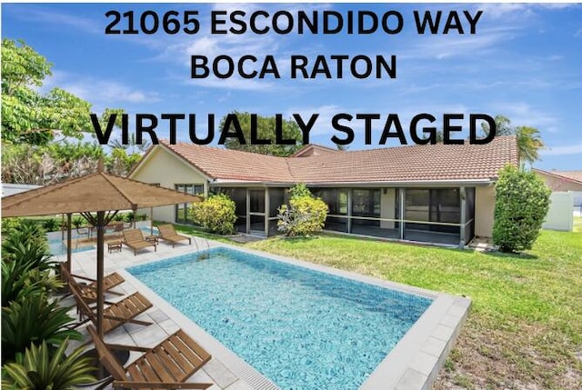 21065 Escondido Way, Boca Raton, FL 33433 - outdoor pool featuring a sunroom, a lawn, and a patio