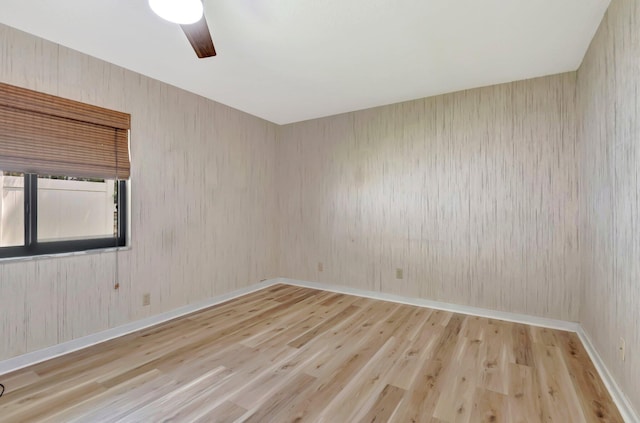 21065 Escondido Way, Boca Raton, FL 33433 - unfurnished room with wood finished floors, a ceiling fan, and baseboards