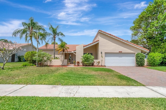 21065 Escondido Way, Boca Raton, FL 33433 - view of front of house featuring a tiled roof, a garage, decorative driveway, stucco siding, and a front yard