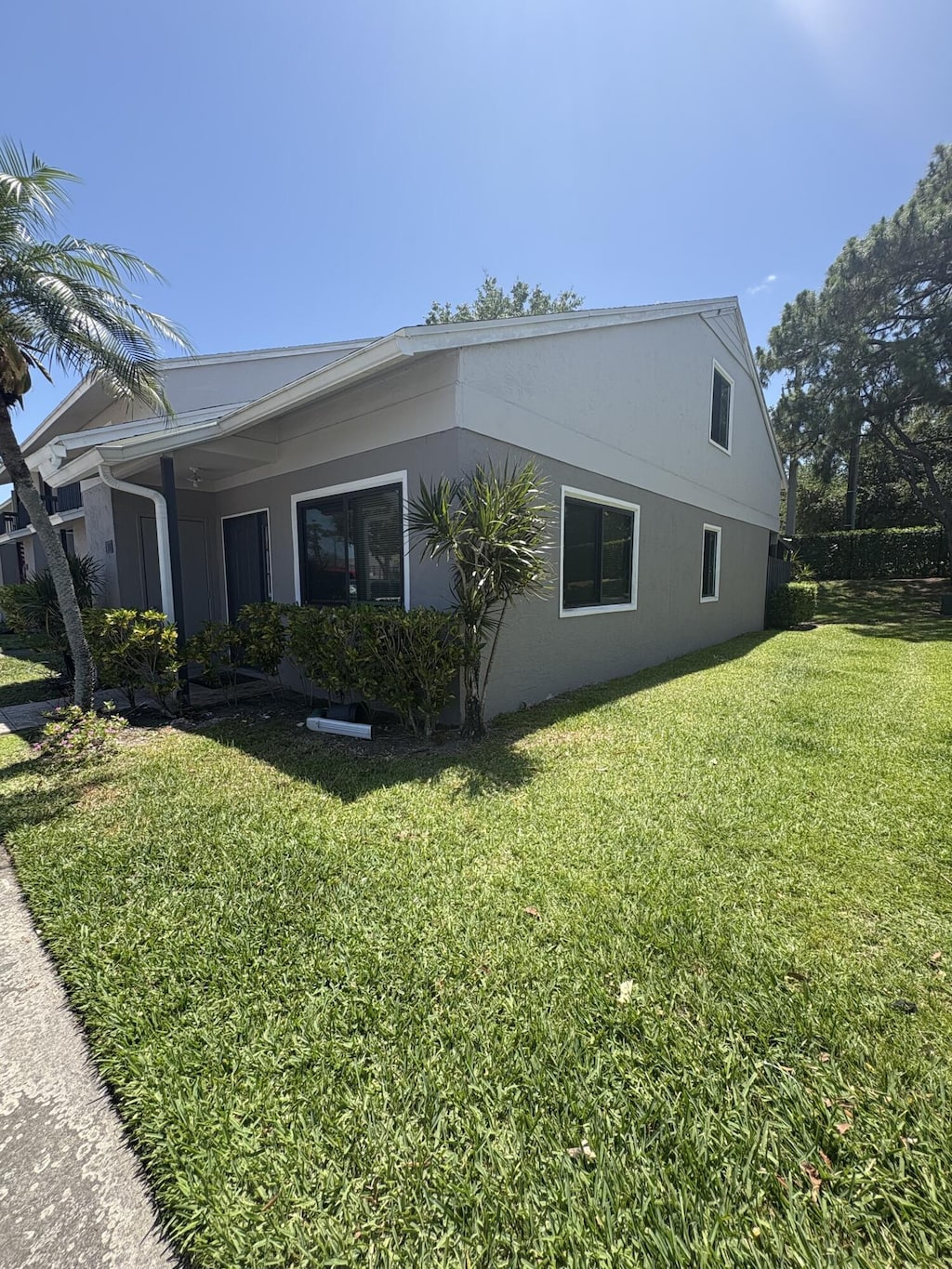 view of side of home featuring a lawn