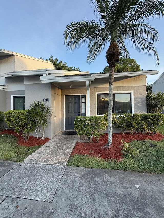 401 Shoreview Dr, Greenacres, FL 33463 - view of property exterior with a lawn