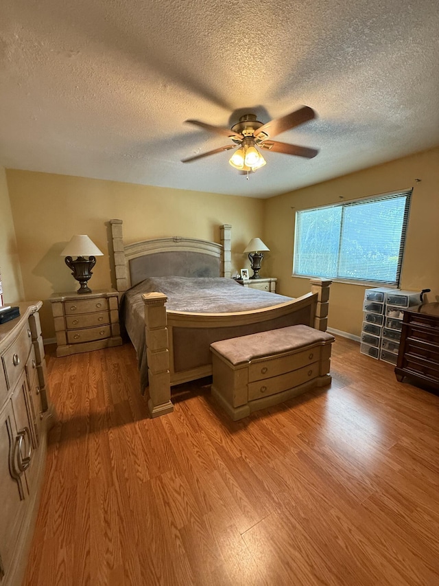 401 Shoreview Dr, Greenacres, FL 33463 - bedroom featuring light wood-style flooring, a textured ceiling, and ceiling fan
