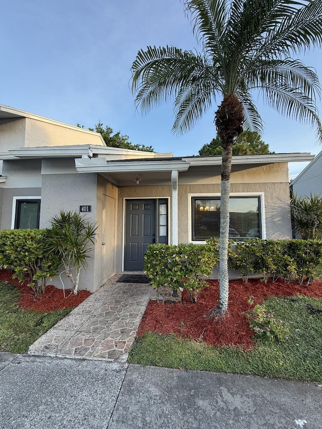 401 Shoreview Dr, Greenacres, FL 33463 - entrance to property featuring stucco siding and roof with shingles