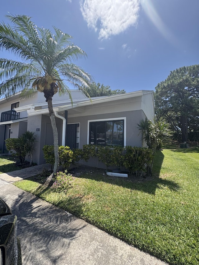 401 Shoreview Dr, Greenacres, FL 33463 - view of front facade featuring a front lawn and stucco siding