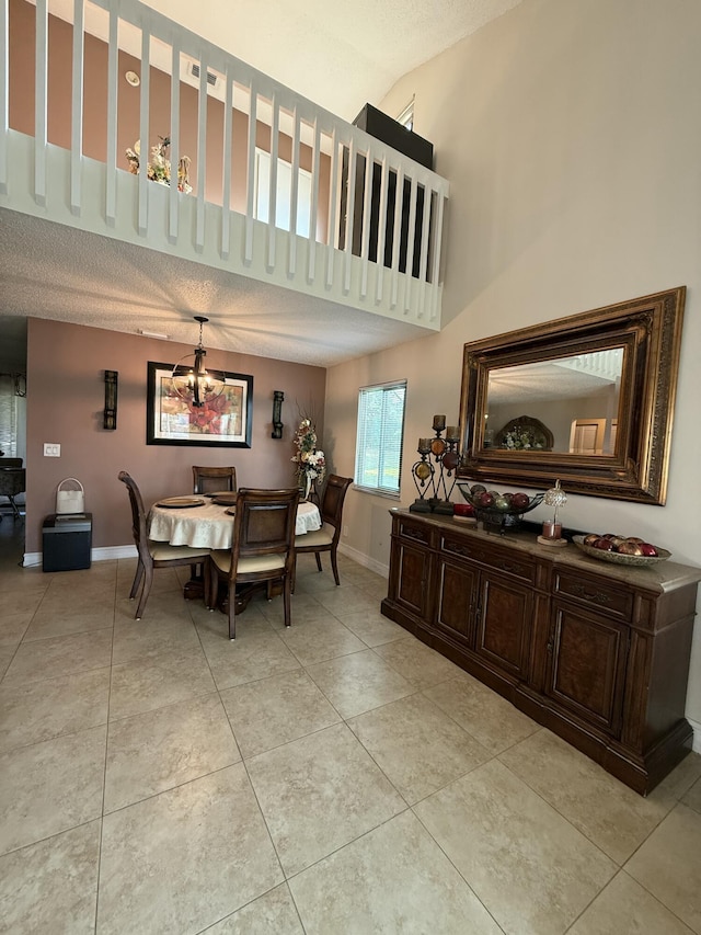 401 Shoreview Dr, Greenacres, FL 33463 - dining space featuring light tile patterned floors, baseboards, and a chandelier