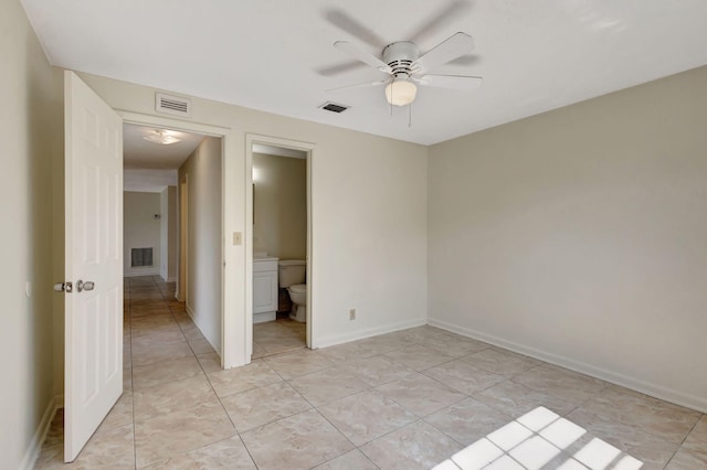 unfurnished bedroom featuring light tile patterned floors, baseboards, ceiling fan, and connected bathroom