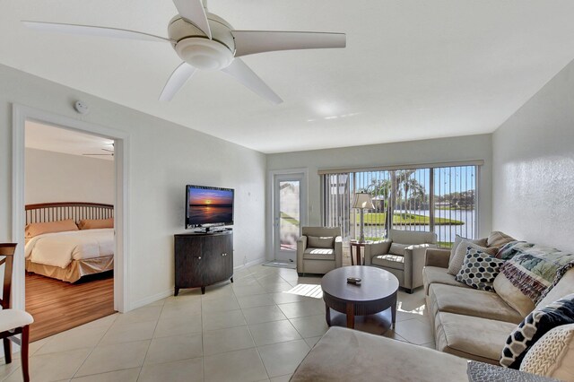 9214 Flynn Cir # 6, Boca Raton, FL 33496 - living room with baseboards, a ceiling fan, and light tile patterned flooring