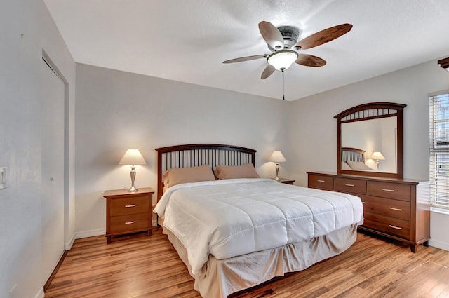 9214 Flynn Cir # 6, Boca Raton, FL 33496 - bedroom with baseboards, ceiling fan, and light wood-style flooring