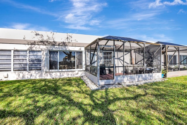 9214 Flynn Cir # 6, Boca Raton, FL 33496 - back of house with a lawn and a lanai