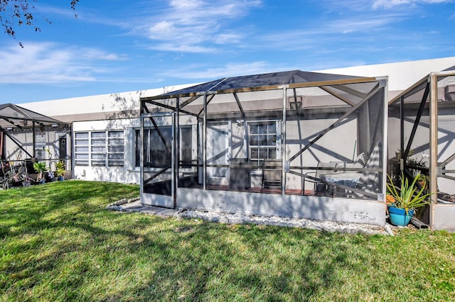 9214 Flynn Cir # 6, Boca Raton, FL 33496 - back of house featuring a lawn and a lanai