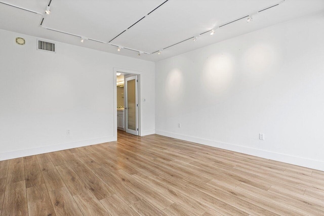 2774 S Ocean Blvd Unit 106, Palm Beach, FL 33480 - unfurnished room featuring track lighting, light wood-type flooring, and baseboards