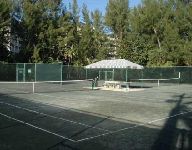 2774 S Ocean Blvd Unit 106, Palm Beach, FL 33480 - view of tennis court with fence