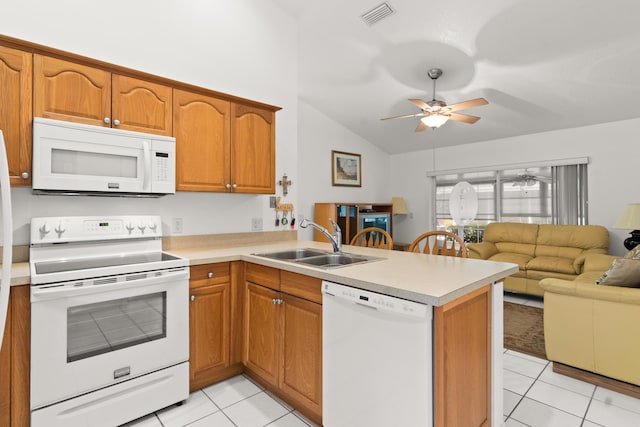 460 NW Turin Ct, Port Saint Lucie, FL 34986 - kitchen featuring white appliances, a sink, light tile patterned floors, a peninsula, and open floor plan