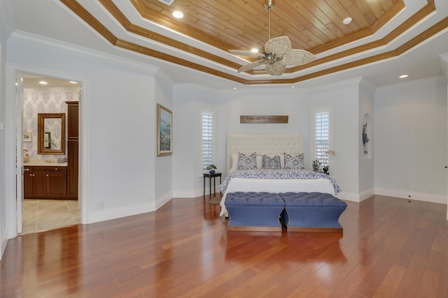 10841 SE Arielle Ter, Jupiter, FL 33469 - bedroom with light wood-style floors, baseboards, wooden ceiling, a tray ceiling, and ornamental molding