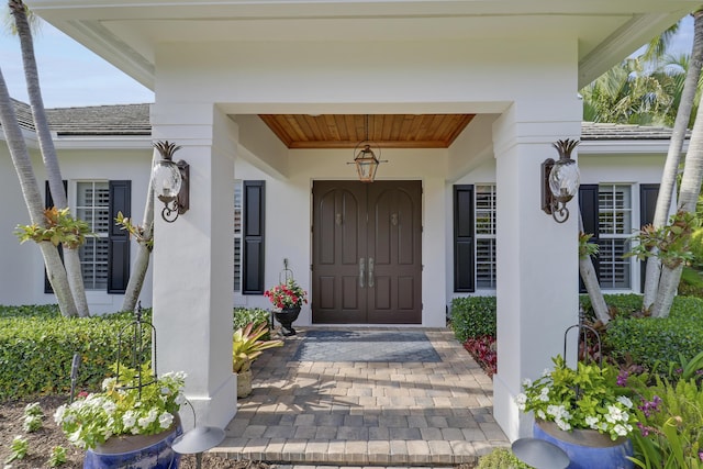 10841 SE Arielle Ter, Jupiter, FL 33469 - entrance to property featuring stucco siding and a porch